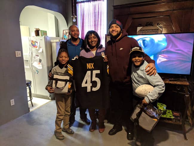 Pictured in Photo: The Johnson family from McKeesport, PA with Roosevelt Nix, Fullback of Pittsburgh Steelers.